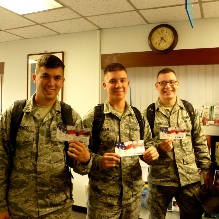 U.S. service members celebrate Cell Phones For Soldiers’ 200 millionth donated minute, November 2013.